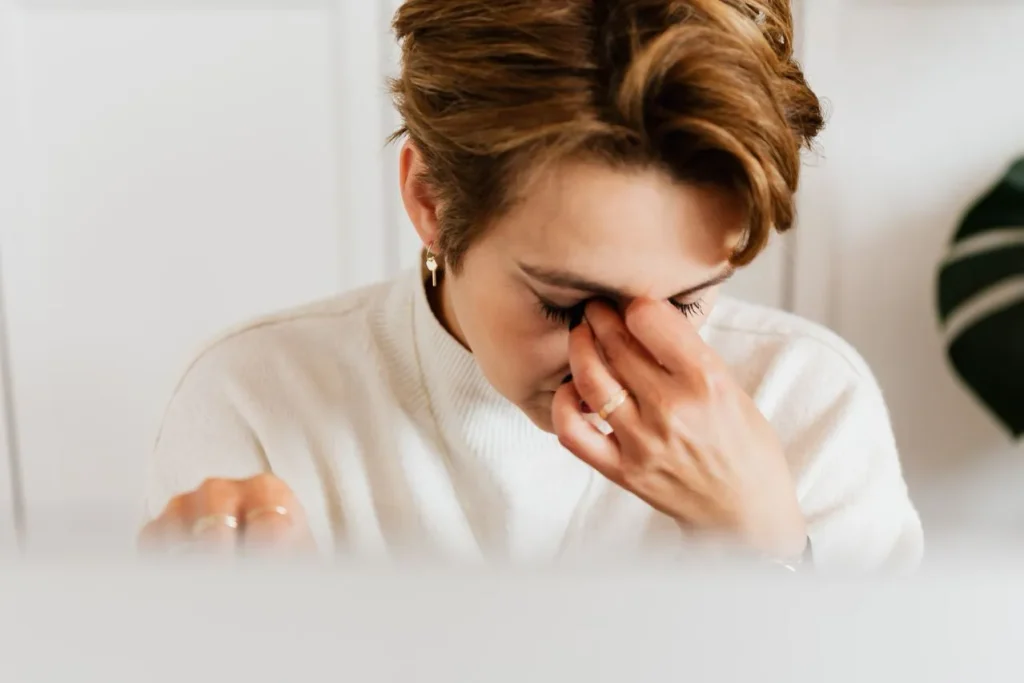 person experiencing stress while trying to focus